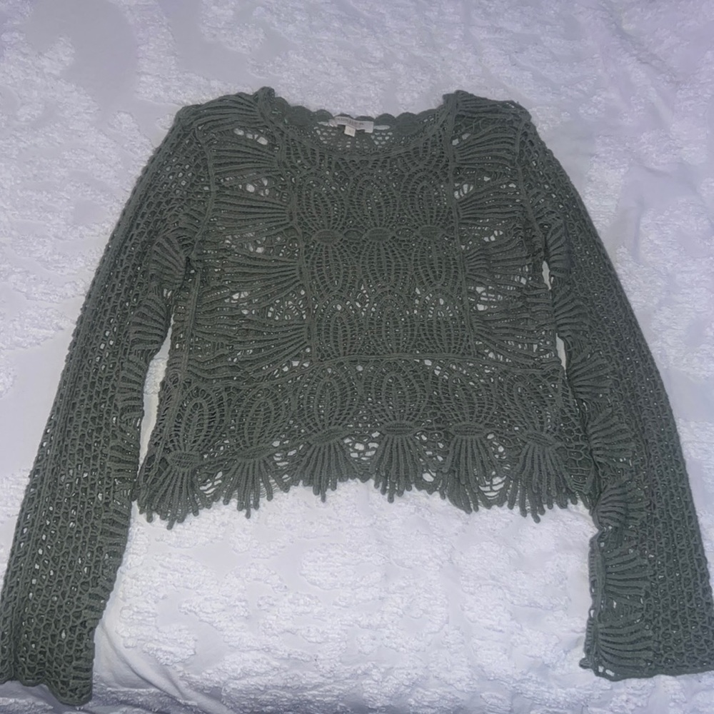 Pale olive green crochet style sweater.